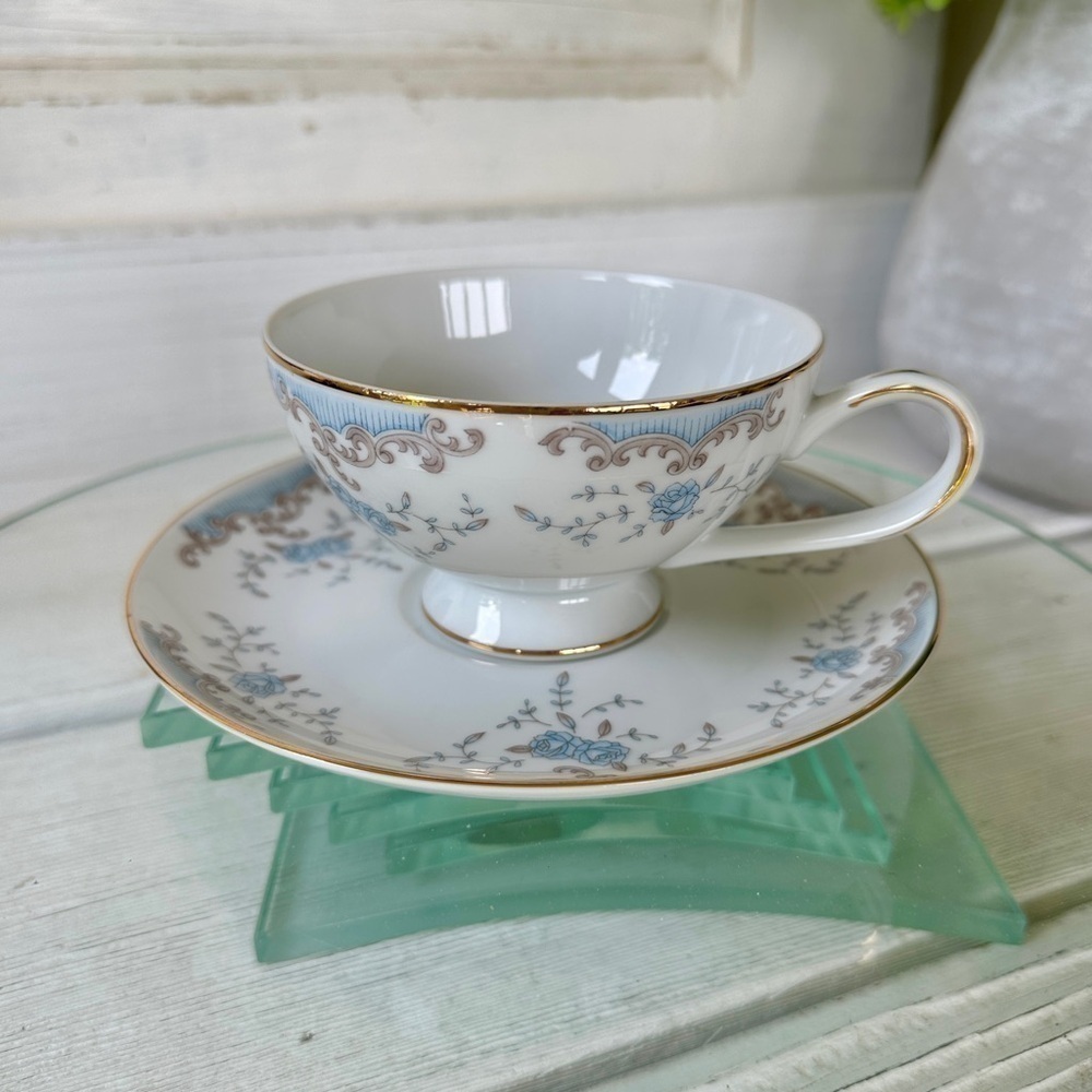 IMPERIAL SEVILLE CHINA CUP & SAUCER. WHITE WITH BLUE FLORAL DESIGN & GOLD TRIM.
